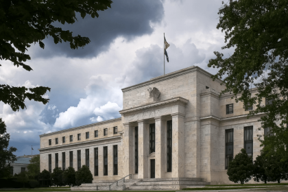 Exterior view of the Federal Reserve building under cloudy skies