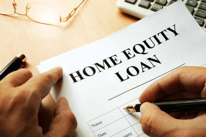 Homeowner signing home equity loan application