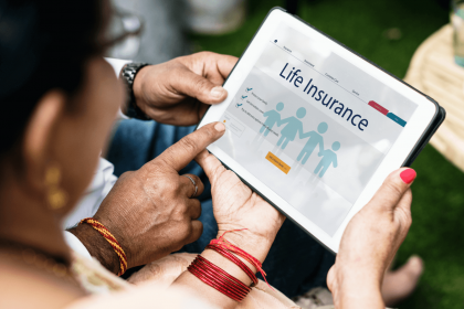 Couple exploring life insurance options on a tablet