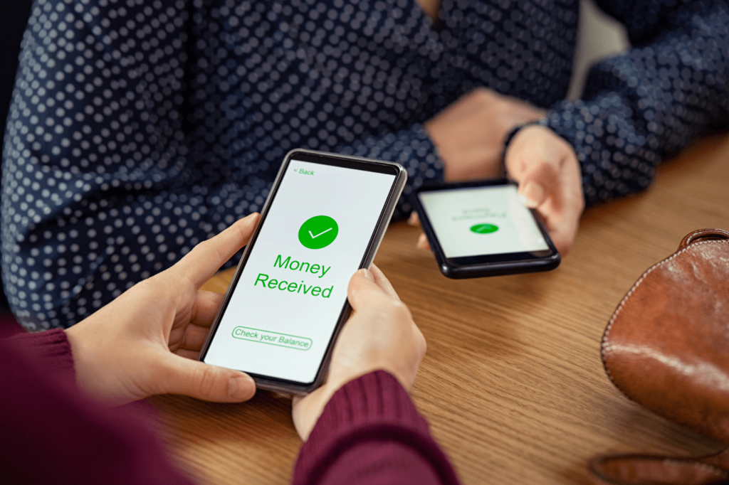 People using mobile apps to transfer money