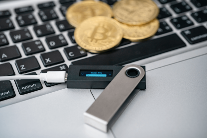 Ledger Nano X hardware wallet connected to a laptop
