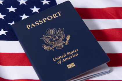 U.S. Passport on top of an American flag