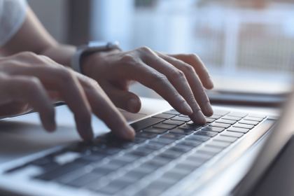 Typing hands on a keyboard