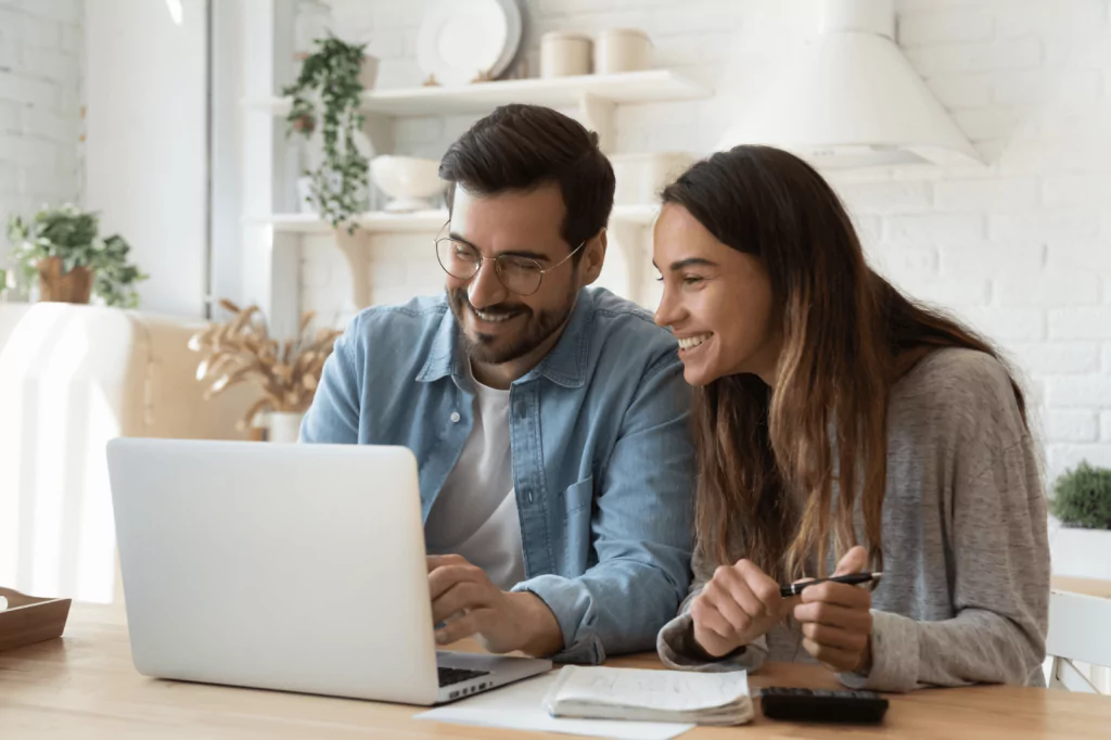 Couple managing their finances through online banking