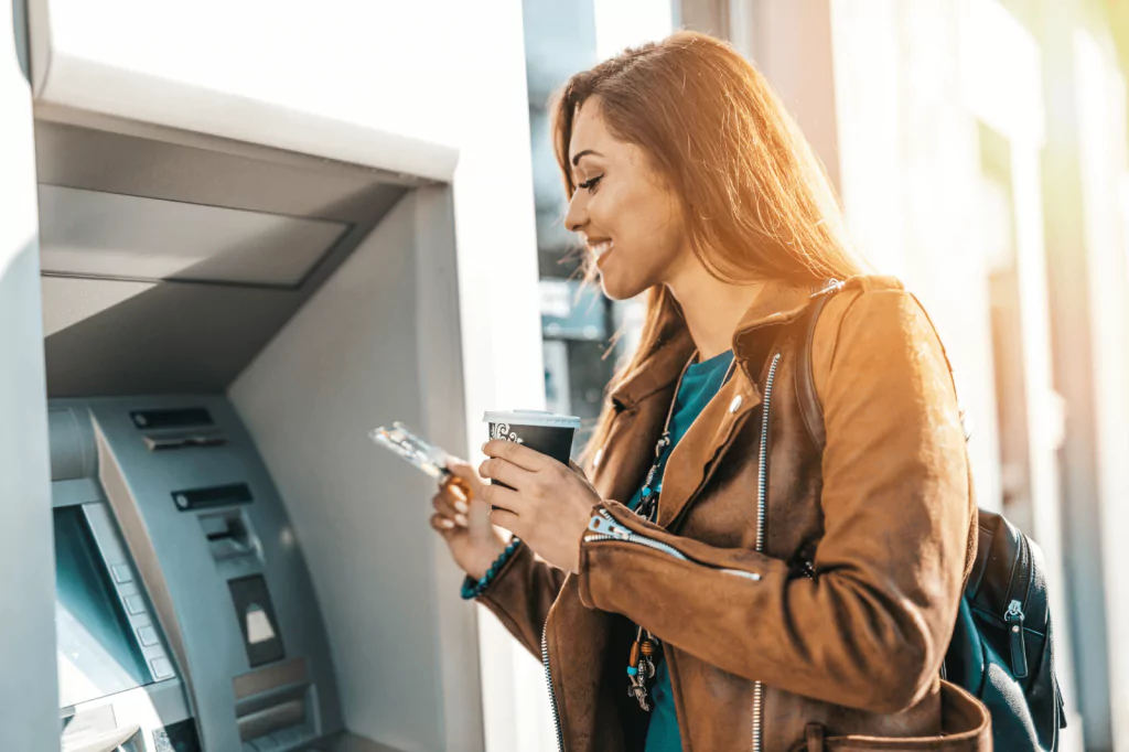 Woman using an ATM machine