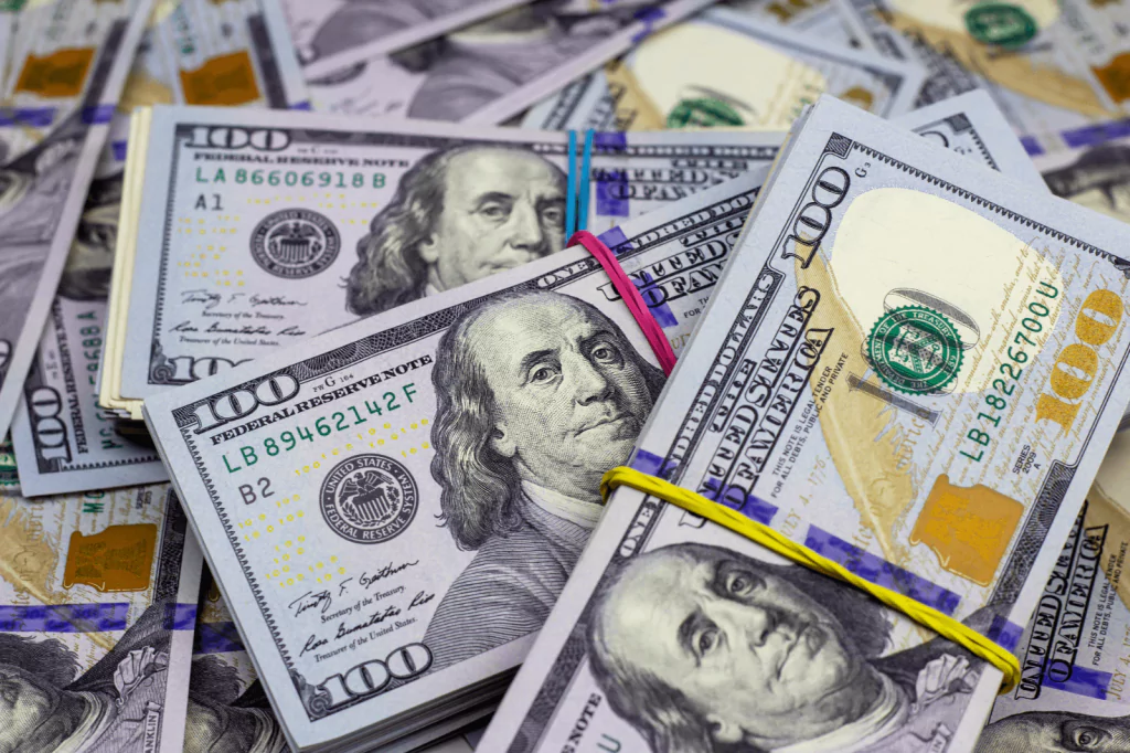 Bundles of hundred-dollar bills representing national debt and financial policies.