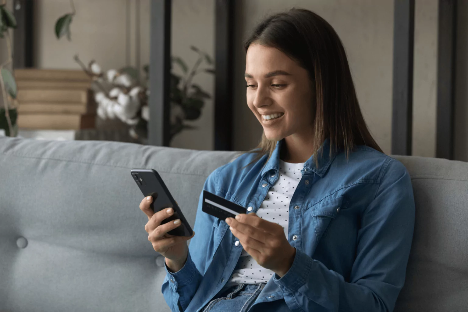 Woman checking her Bank of America card balance on a smartphone