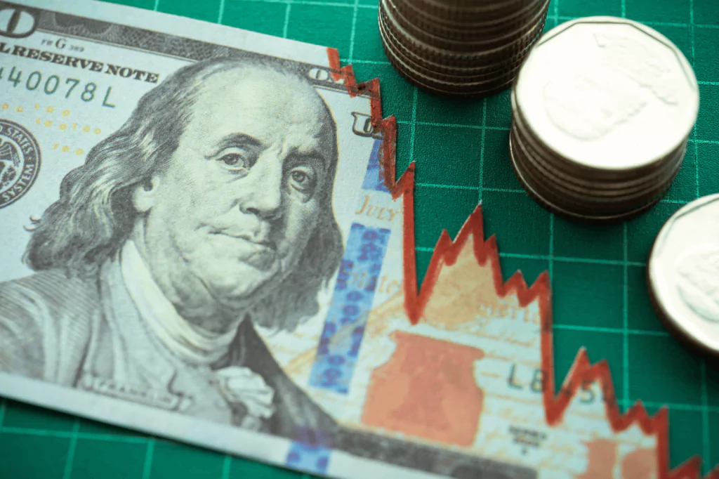 Dollar bill with declining graph indicating economic conditions