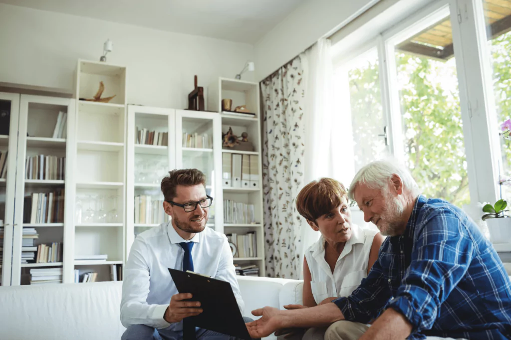 Elderly couple consulting a financial advisor