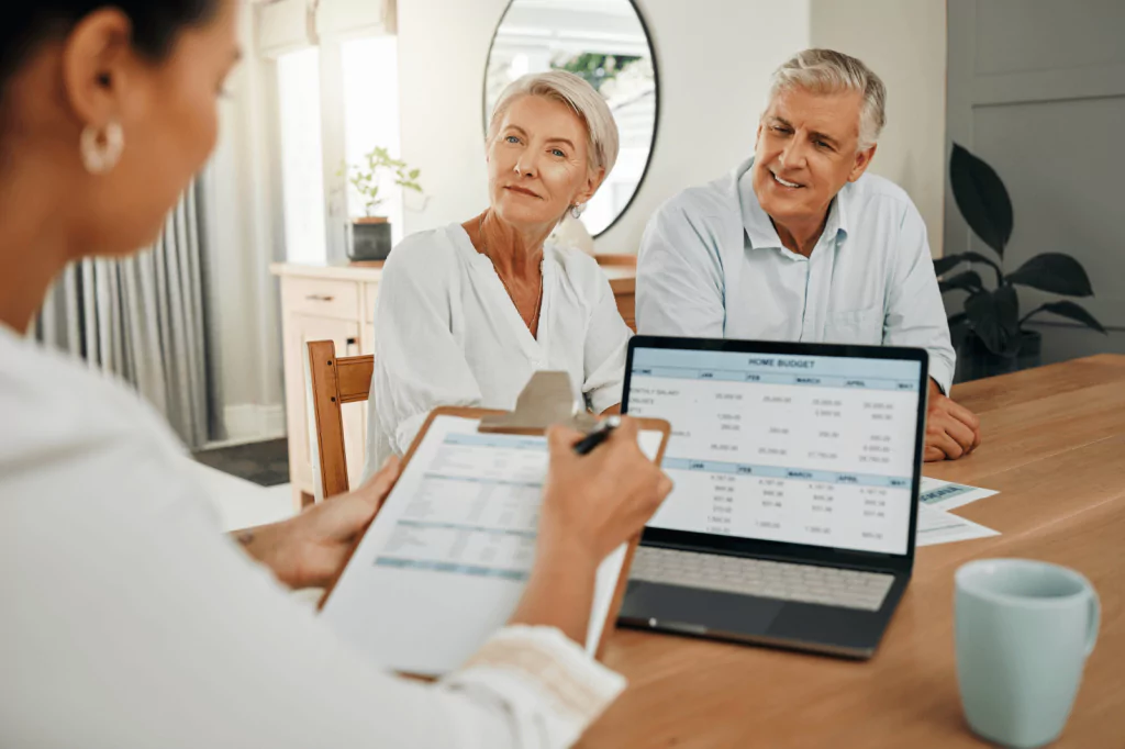 Elderly couple meeting with a financial planner