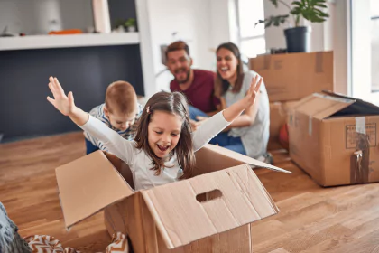 Family moving into their new home after securing mortgage insurance