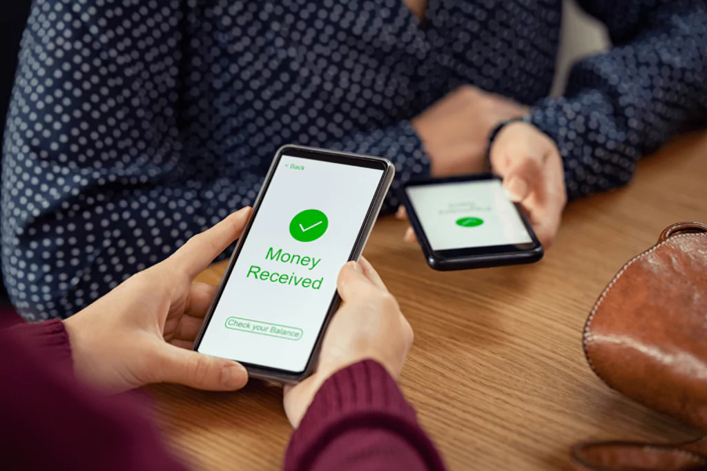 People using mobile apps to transfer money