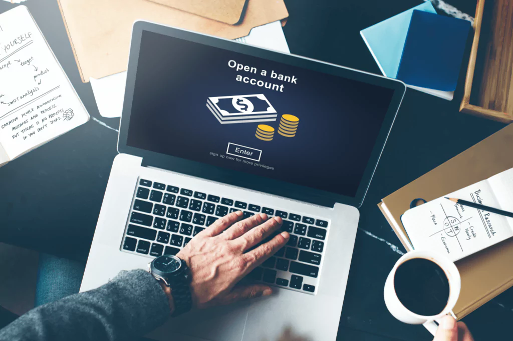 Person opening a bank account on a laptop