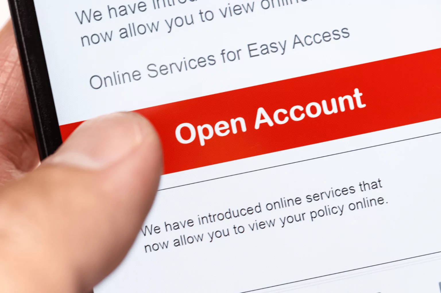 Person using a mobile device to open a bank account online.