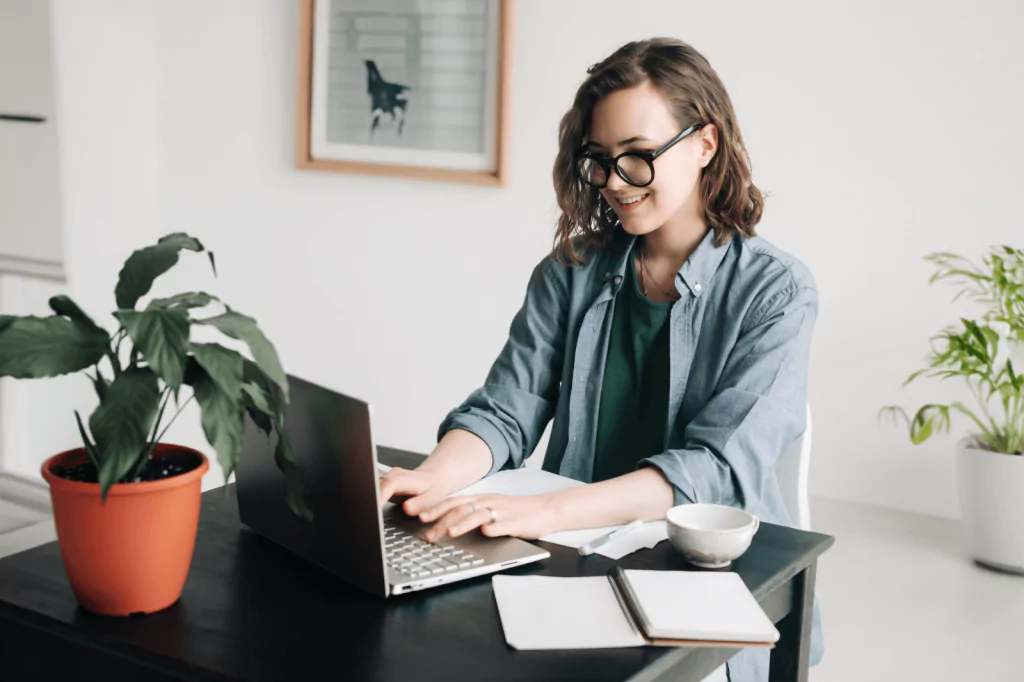 Woman working on a laptop at home