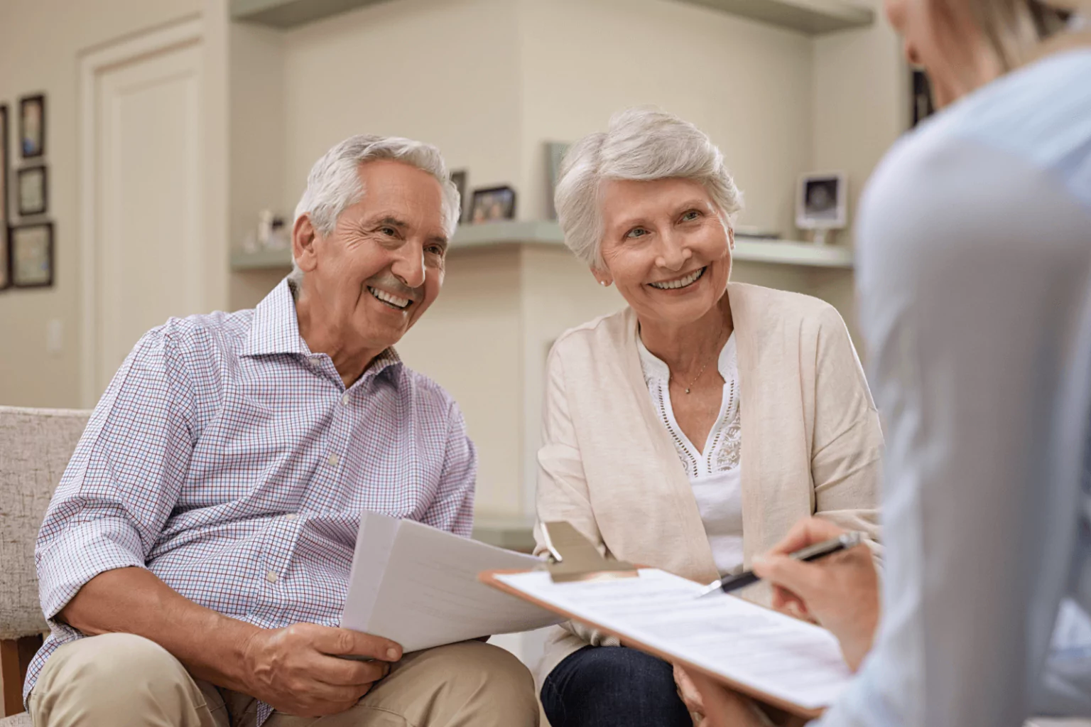 Senior couple consulting with a financial advisor at Bank of America.